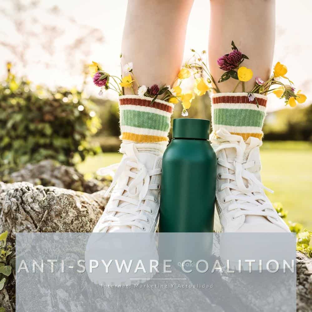 person wearing white and yellow floral rain boots